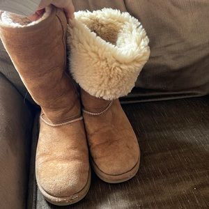Tall bomber style Ugg boots. Used but shearling inside is still soft.
